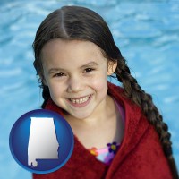 alabama map icon and a little girl wrapped in a dark red towel, in front of a swimming pool
