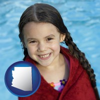 arizona map icon and a little girl wrapped in a dark red towel, in front of a swimming pool