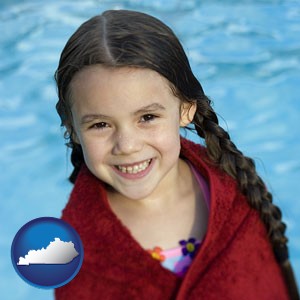 a little girl wrapped in a dark red towel, in front of a swimming pool - with Kentucky icon