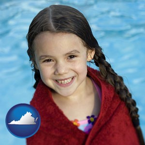 a little girl wrapped in a dark red towel, in front of a swimming pool - with Virginia icon