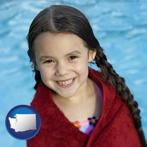 a little girl wrapped in a dark red towel, in front of a swimming pool - with Washington icon